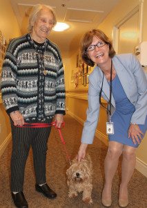 Provincial Seniors Advocate Isobel Mackenzie (right) makes a connection with Toby, accompanied by owner and Sunridge resident Christina Radcliffe (left) during a visit to Sunridge Place in Duncan on Friday, July 11. 