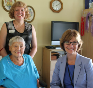 Provincial Seniors Advocate Isobel Mackenzie (left) connects with Sunridge resident Lorna Taylor (right) and Director of Care Debbie Easson (standing) during a visit to Sunridge Place in Duncan on Friday, July 11.