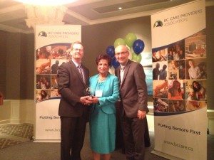 Jane Devji receives the Ed Helfrich Long Service award after more than 40 years of devotion